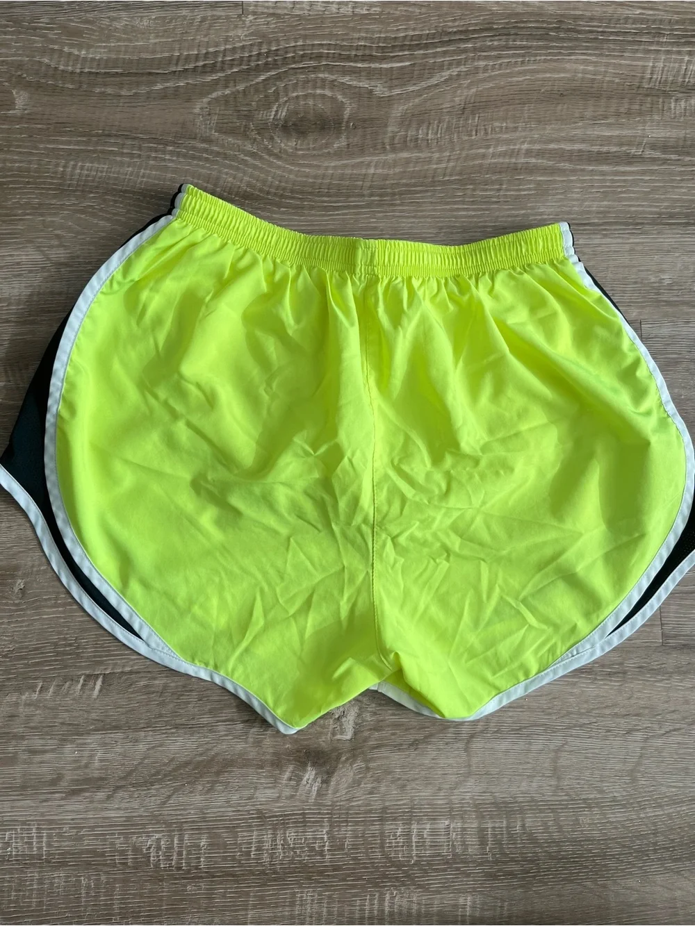 Nike women’s medium tempo running shorts highlighter yellow with black trim
